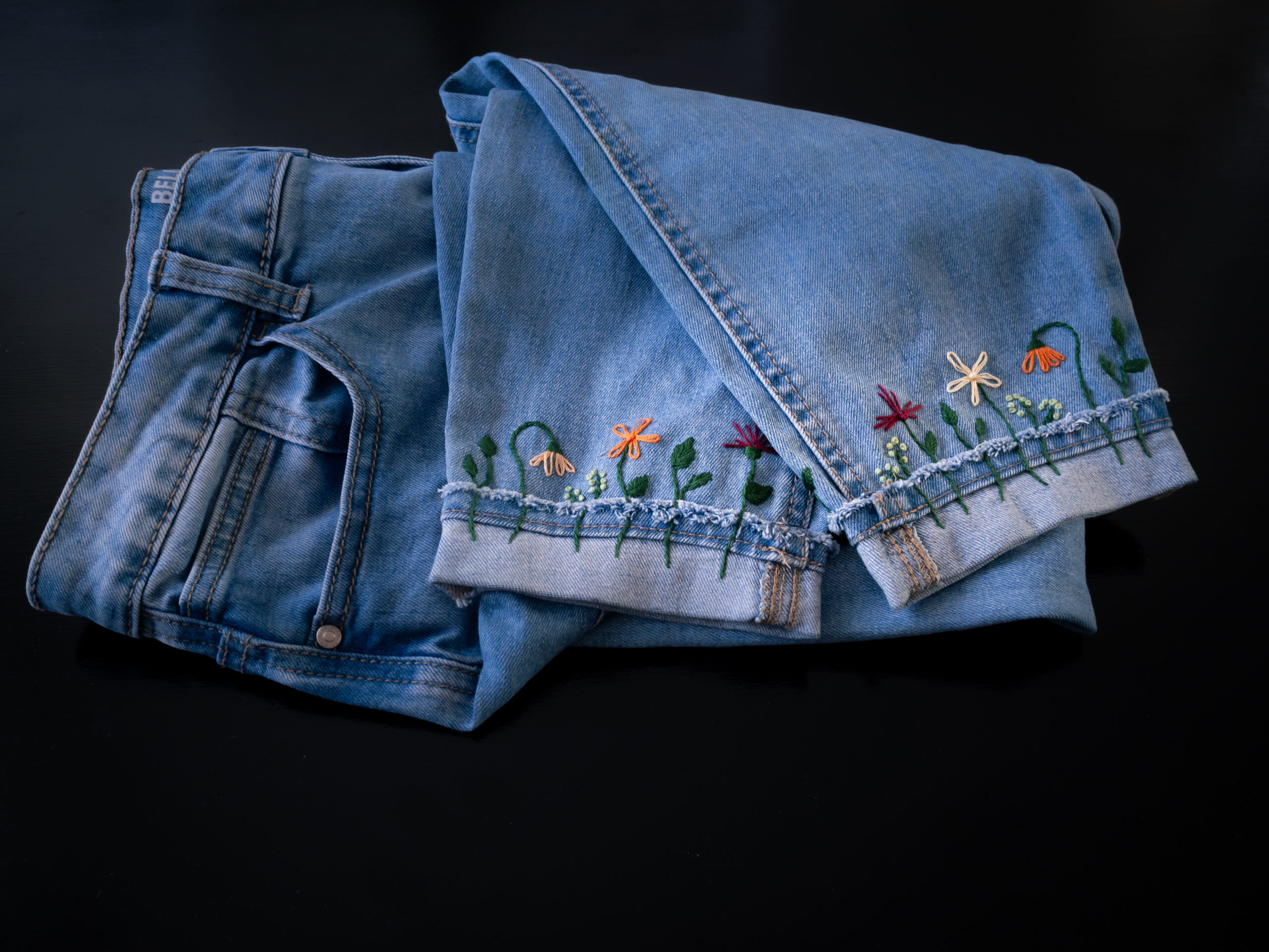 Floral embroidered jeans cuffs